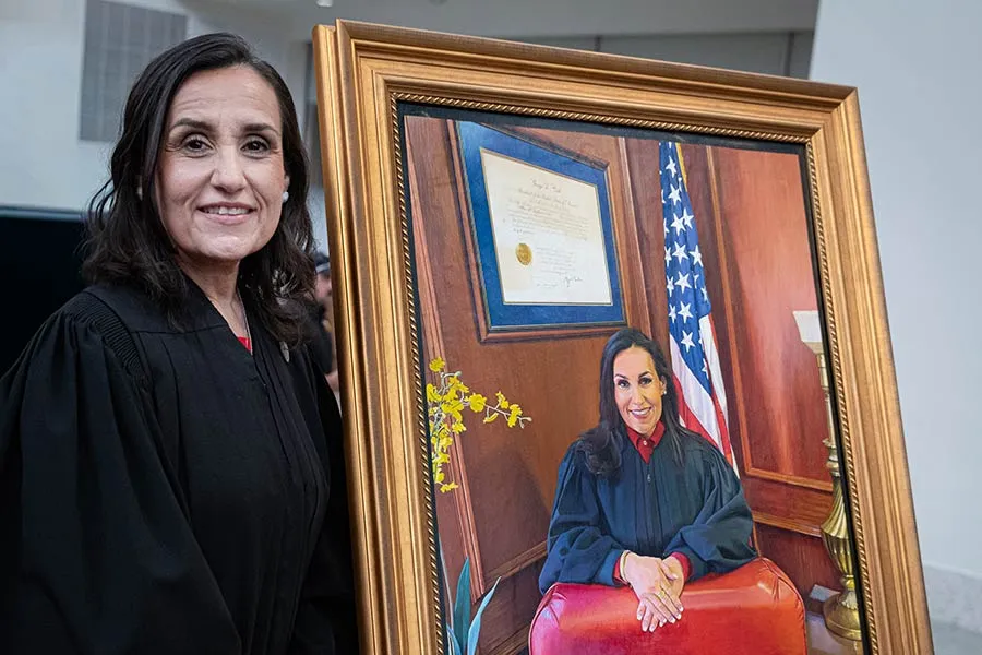Chief U.S. District Judge Alia Moses stands with her portrait