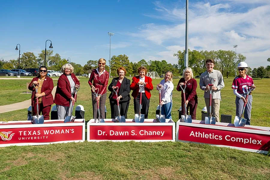 TWU Chancellor Carine M. Feyten breaks ground for the Chaney Athletics Complex along with Cheney herself and others