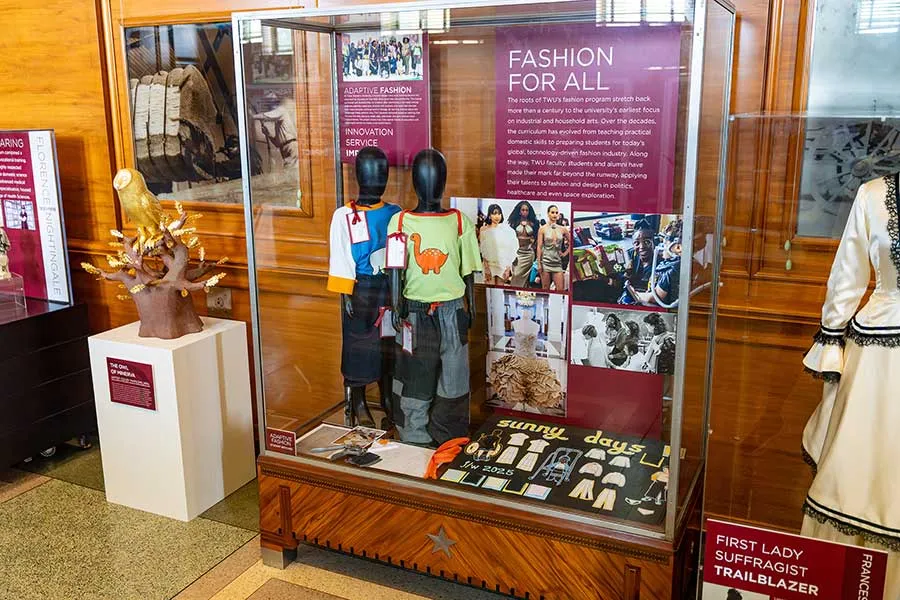 TWU State Fair exhibit cabinet featuring the Division of Fashion Design & Merchandising