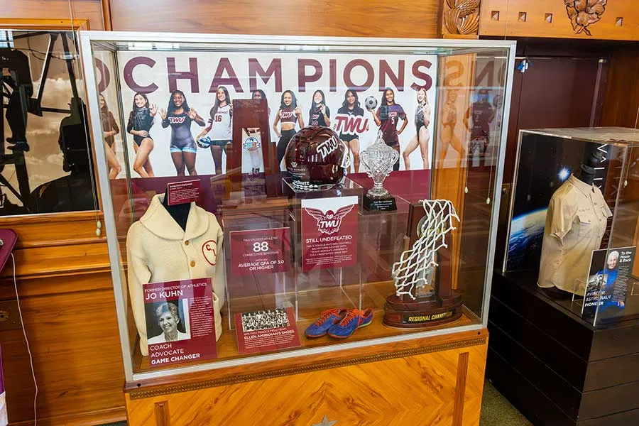 TWU State Fair exhibit cabinet featuring the university's Athletics program