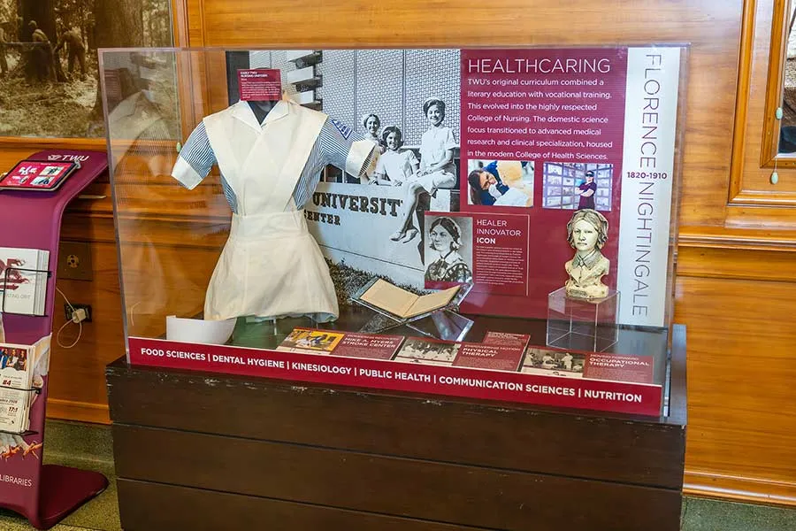 TWU State Fair exhibit cabinet featuring the university's health care history
