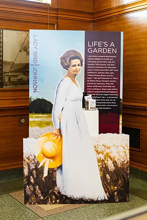 A poster of Ladybird Johnson as part of the Texas State Fair 