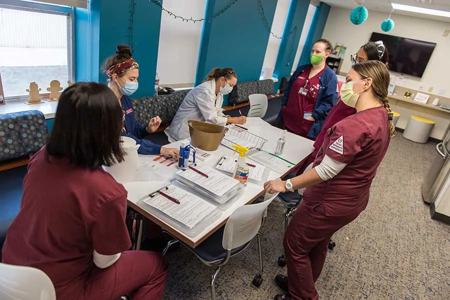 Student Health Services and nursing students work together