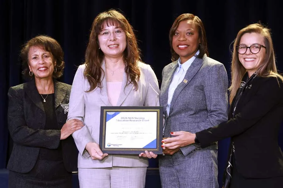 Lee and team receive the Nancy Langston Award from the National League for Nursing