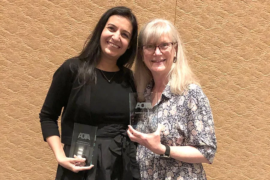 Priyanka Kapoor, ‘10 (left) and Cynthia Evetts, PhD (right) stand together holding awards