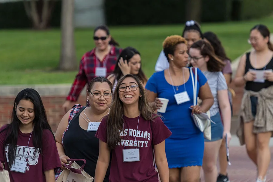 First-year Orientation students walking across campus