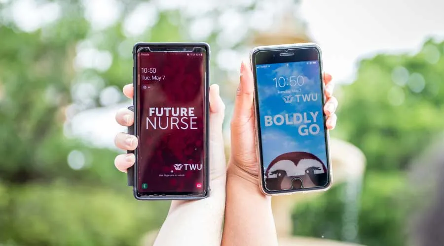 TWU themed phone wallpapers on two smartphones.
