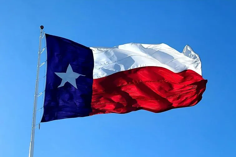 The Texas flag waving in the wind.