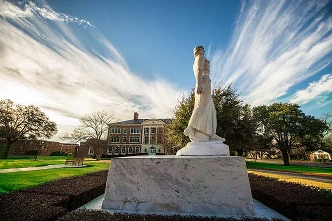 TWU Pioneer statue, Minerva, with epic clouds behind her.