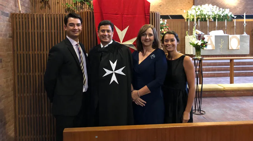 Ronald S. Palomares-Fernandez, Ph.D. (second from left), was joined by his family at his investiture ceremony on April 7 in Boston. 