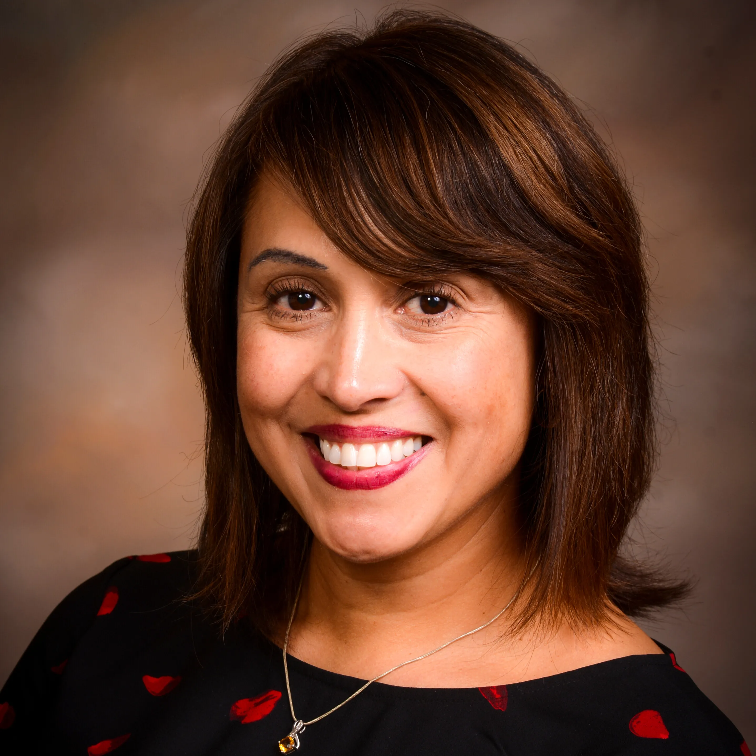 woman smiles directly at camera