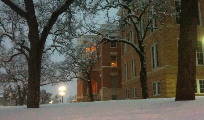 Snow fall with TWU's Old Main Building in the back. 