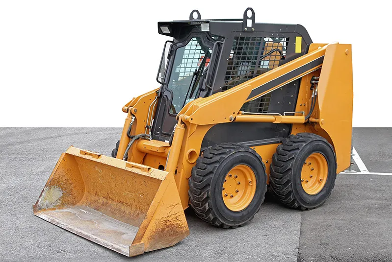 Image of a yellow and black skid steer loader.