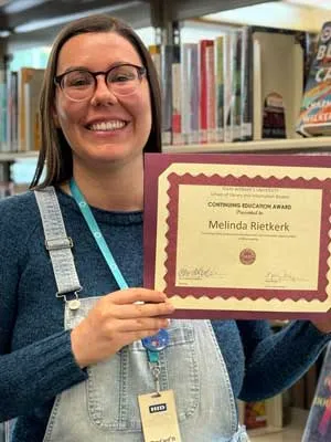 Reitkerk displays her Continuing Education Award