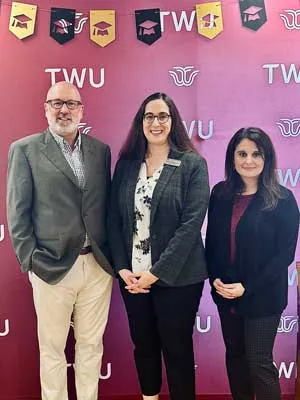 Beta Phi Mu board members Greg Hardin, Gretchen Hoffman, PhD, and Lilly Ramin