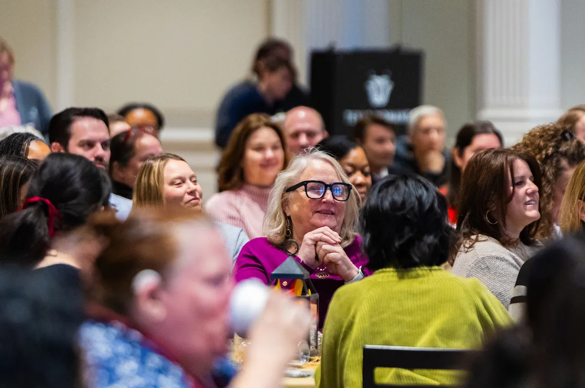 staff members sitting at crowded tables at the 2026 Winter Warm-up