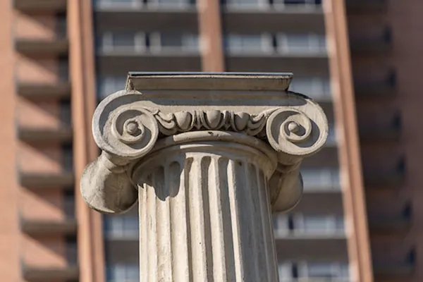 Pillar in front of the TWU tower representing outstanding achievement.