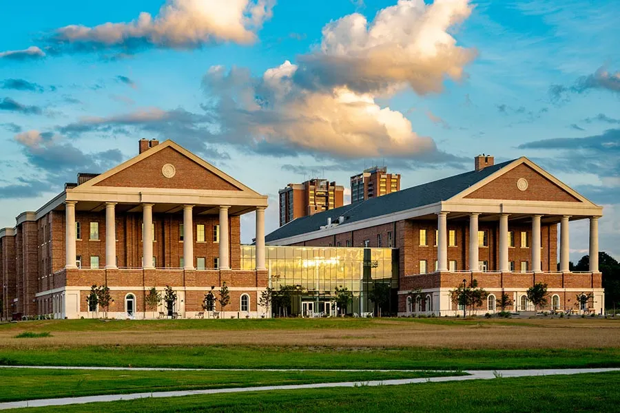 exterior shot of Health Sciences Center on a bright cloudy day