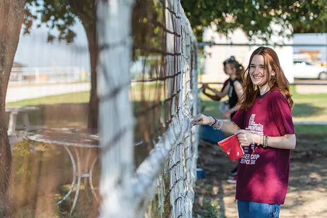 TWU student participating in a service project