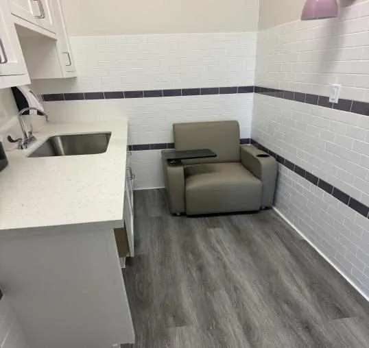 TWU Houston lactation room with a chair and a sink