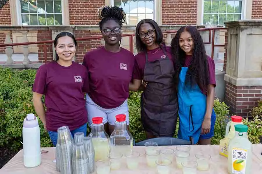 TWU students at the Art with a Twist event serving lemonade