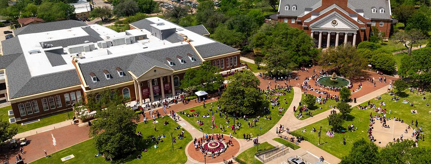 An overhead view of the TWU Denton campus library and student union during a busy event.