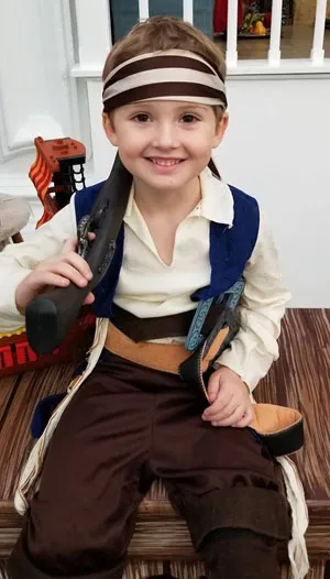 A young boy dressed up as a pirate for a musical