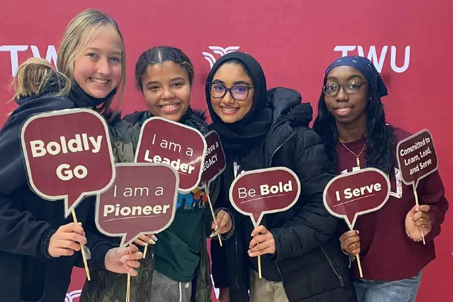 TWU Students with hand messages