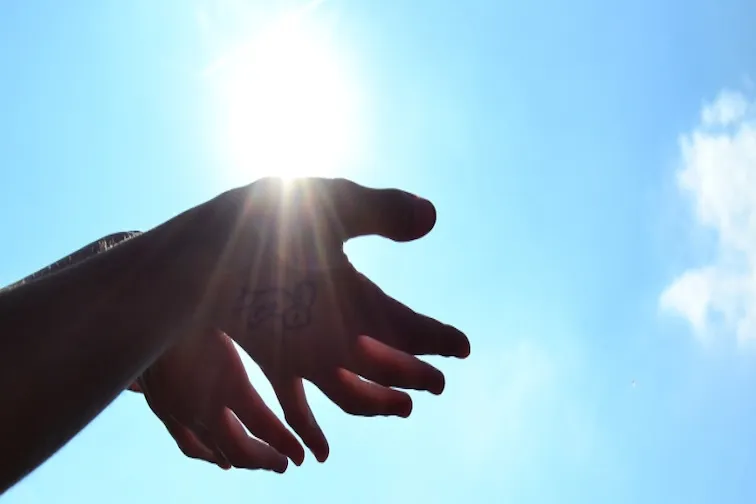 Hands holding the sun