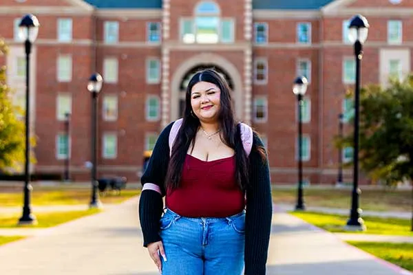 A TWU student portrait outdoors near Parliament Village.
