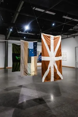 Christine Adame - Homeland Instalation. Hand embroidered flags