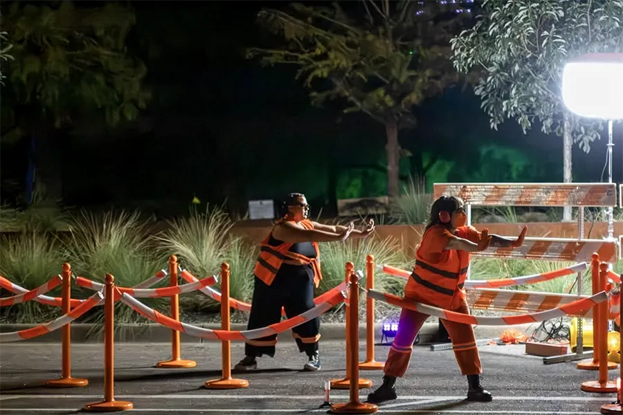 Dancer waves flags to cues during song, during Julie Libersat's, 