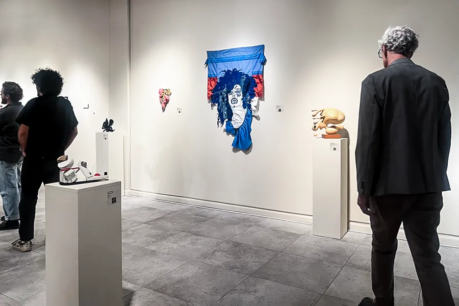 Cher Musico, May May, installed in Materials Hard + Soft, onlookers walk by work