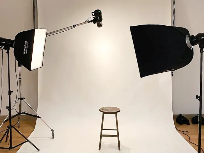 Studio lights and backdrops are set up in the TWU Galleries for a PAC fundraiser