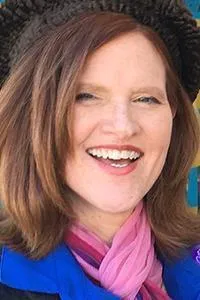 Sheli Petersen - woman smiling, wearing scarf and hat