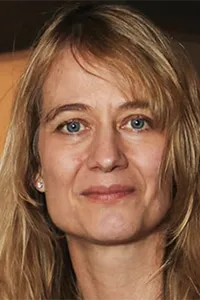 Portrait of Tanya Synar. Woman with blonde hair and blue eyes