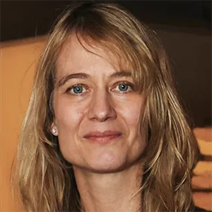 Portrait of Tanya Synar. Woman with blonde hair and blue eyes