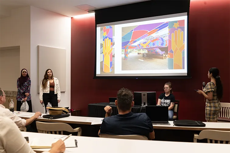 Students propose mural design before panel of administrators