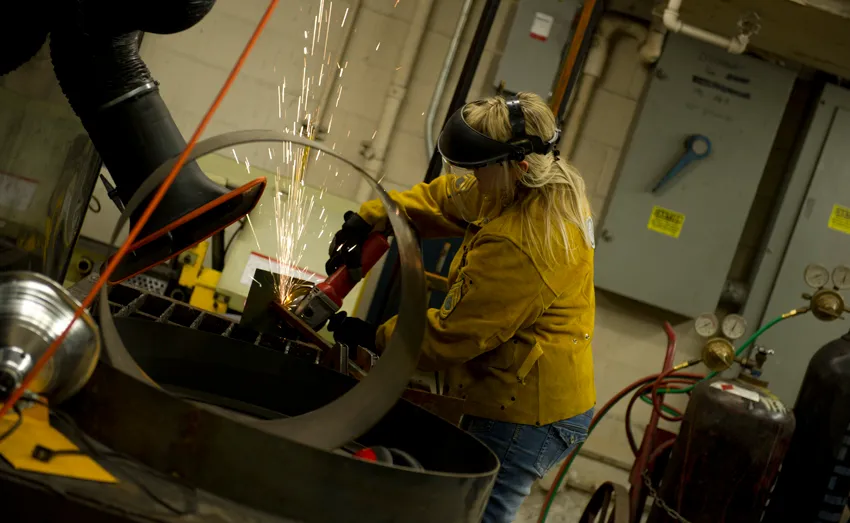 Student working in the metal shop. 