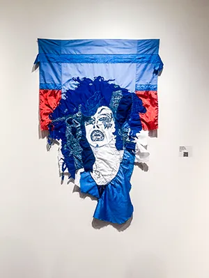 May May, mixed-media textile portrait of woman with mouth open, blue