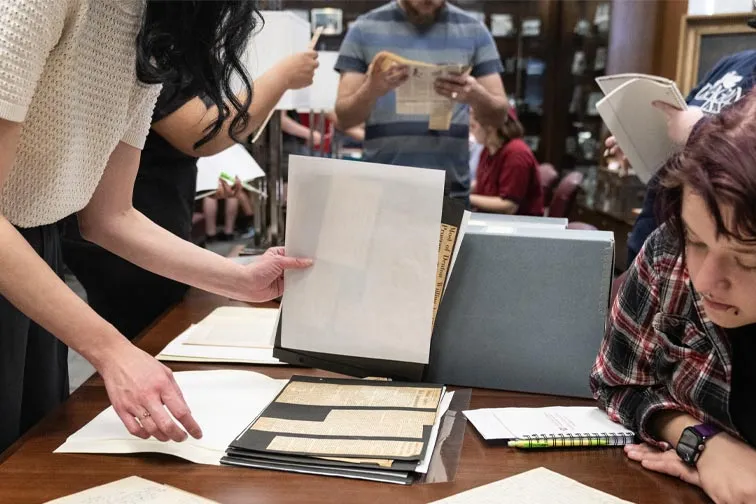 Students looking at notebooks