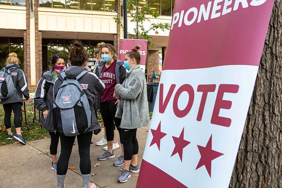 Students gather to begin their walk to the polls for the 2020 election