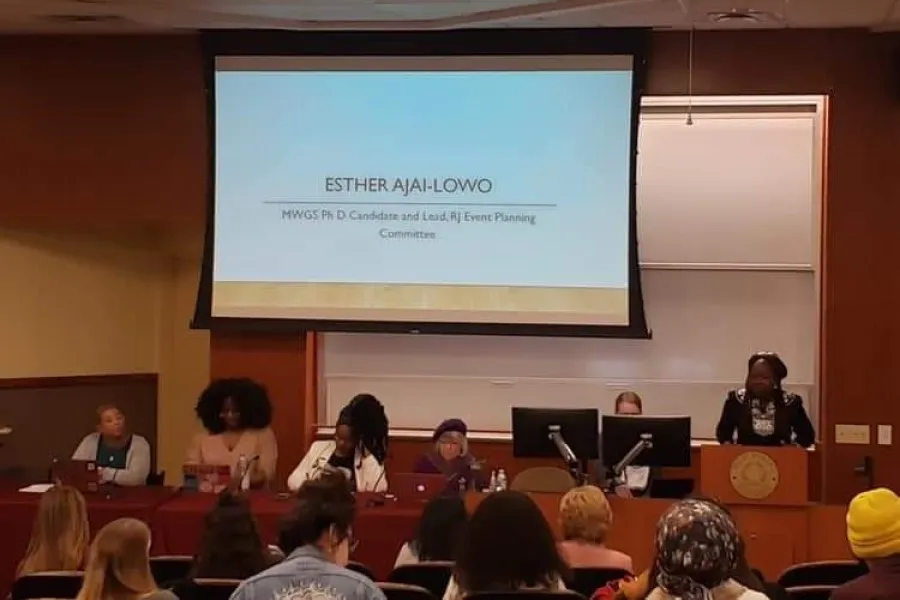 Esther Ajayi-Lowo, MWGS doctoral candidate and planning committee chair, introduces the panel and defines reproductive justice.