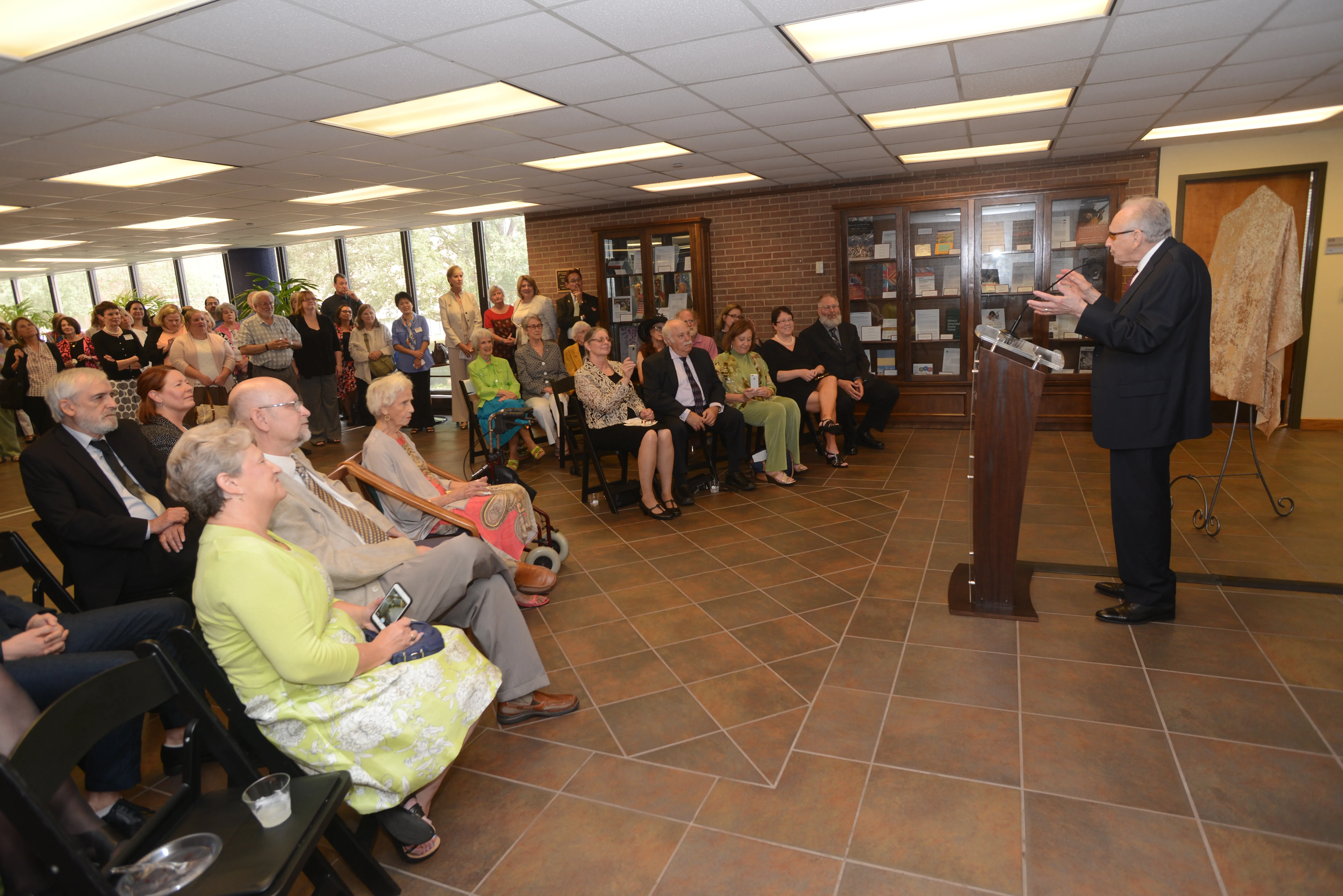 Dr. Woodcock is speaking at dedication ceremony